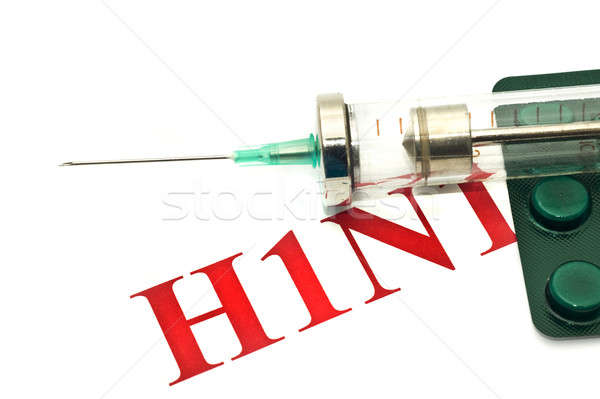 Swine FLU H1N1 disease warning - pills and syringe Stock photo © Arsgera