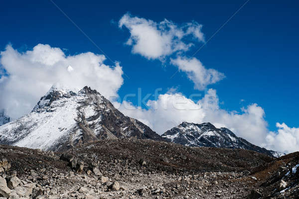 Summit and clouds near Sacred Lake of Gokyo in Himalayas Stock photo © Arsgera