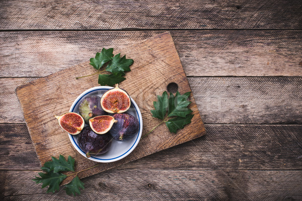 Stock photo: rustic style Cut figs in flat dish on choppingboard