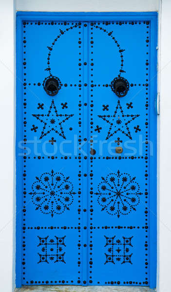 Blue door with ornament from Sidi Bou Said in Tunisia Stock photo © Arsgera