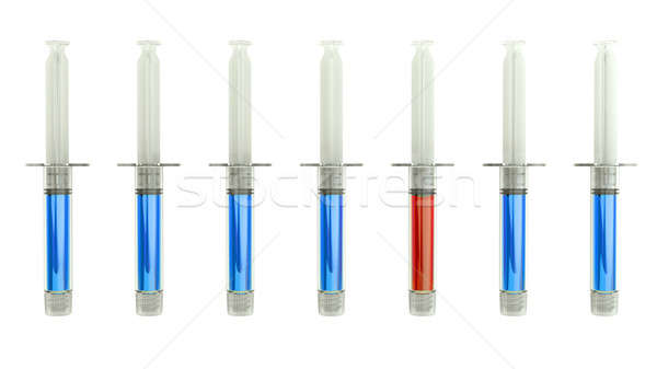 Red syringe among blue ones as right medical choice Stock photo © Arsgera