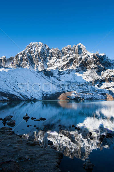 Mountains and reflection in Sacred Gokyo Lake in Himalayas Stock photo © Arsgera