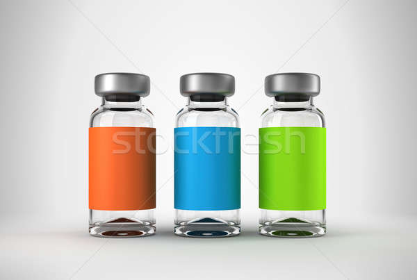 Three medical ampules over grey Stock photo © Arsgera