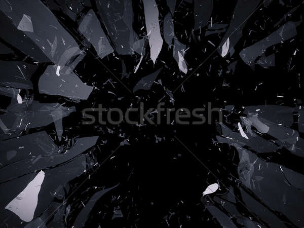 Shattered or demolished glass over black background Stock photo © Arsgera