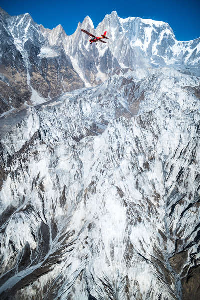 Flying on the plane over Machapuchare summit or fishtail Mountai Stock photo © Arsgera