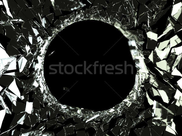 Bullet hole and pieces of shattered glass Stock photo © Arsgera