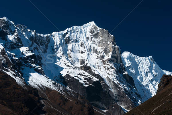 Snowbound mountain range and blue sky in Himalayas Stock photo © Arsgera