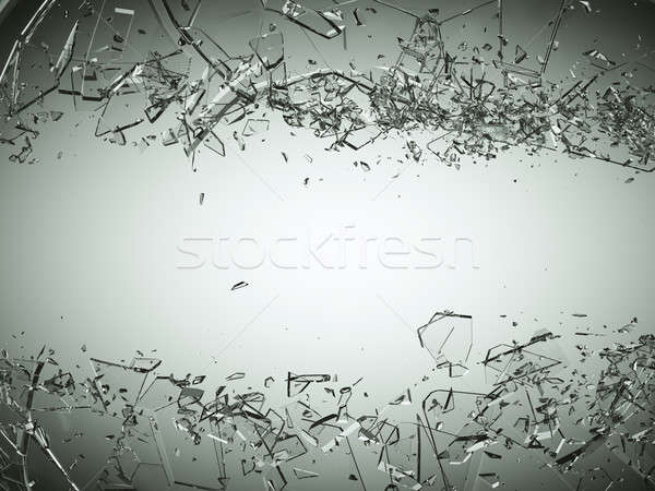 Pieces of splitted or cracked glass on grey Stock photo © Arsgera