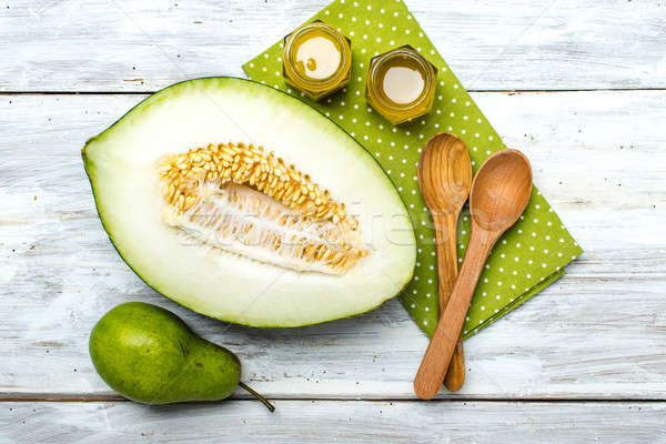 Ripe melon honey and pear on white wood Stock photo © Arsgera