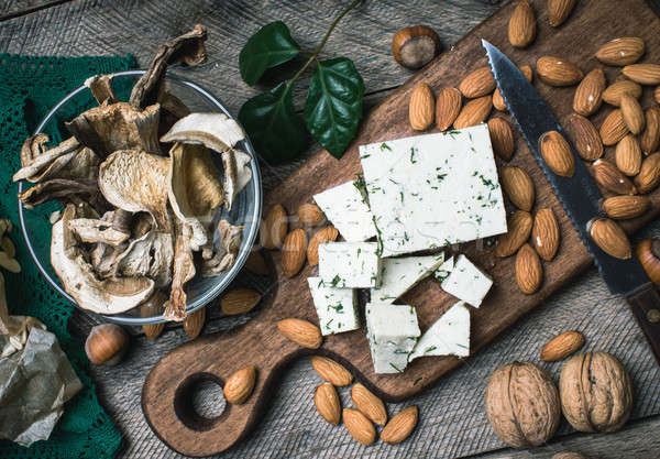 Closeup of cheese, nuts and mushrooms Stock photo © Arsgera