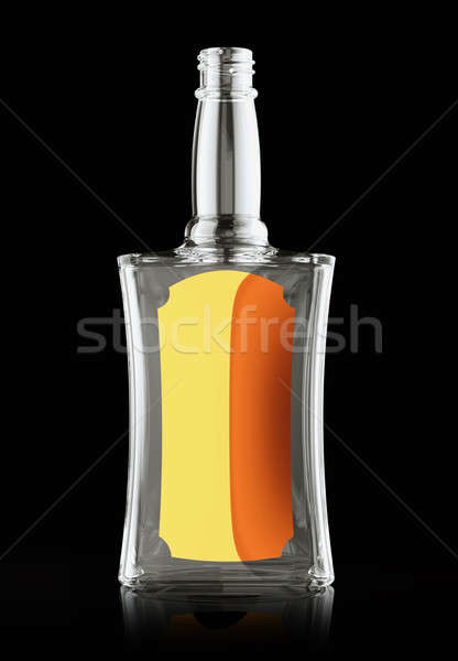 Empty bottle for rum or whisky with golden labe Stock photo © Arsgera