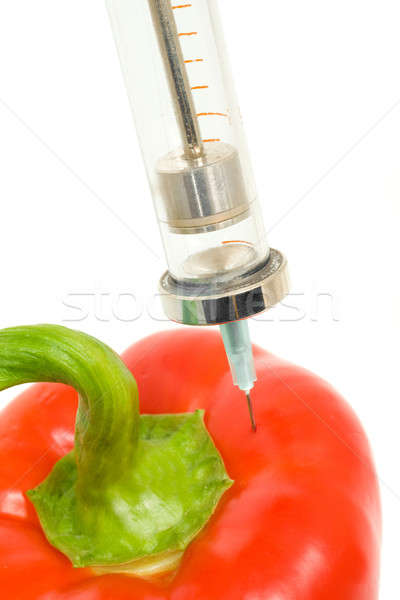 GMO - pepper with sticked aged syringe  Stock photo © Arsgera