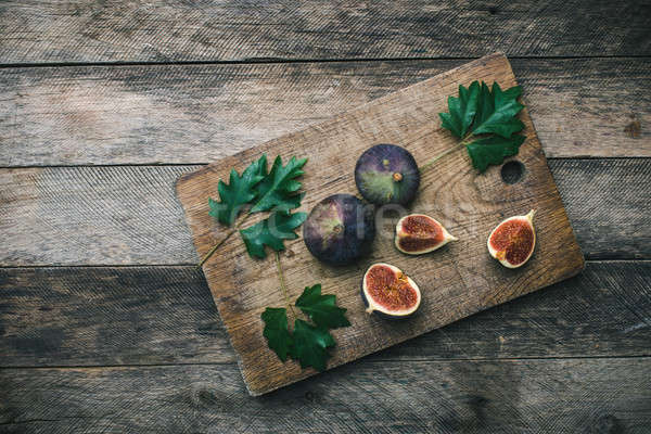 Tasty Figs on chopping board Stock photo © Arsgera