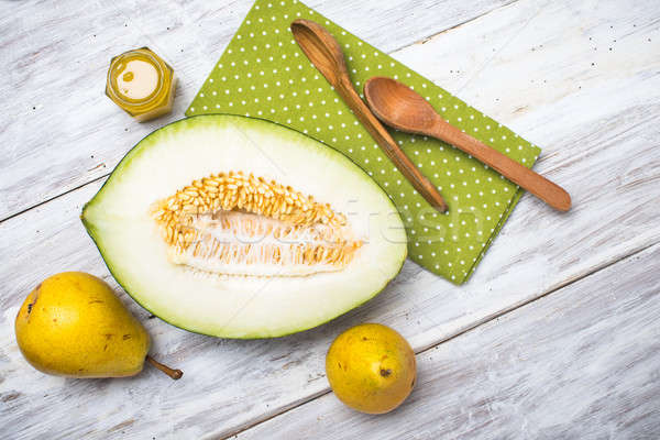 tasty melon with honey and yellow pears on white wood Stock photo © Arsgera