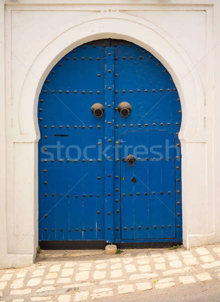 Blue door in Andalusian style from Sidi Bou Said Stock photo © Arsgera