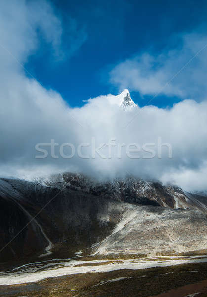 Cholatse summit 6335 m hidden in clouds Stock photo © Arsgera