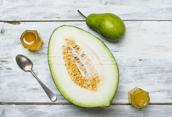 Healthy pear with melon and honey on rustic board Stock photo © Arsgera
