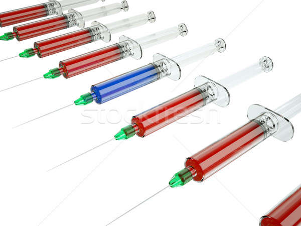 Red syringe among blue ones as right medical choice Stock photo © Arsgera