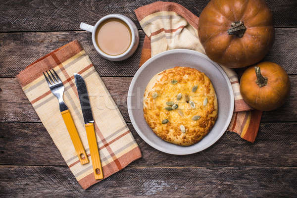 Breakfast coffee and flat cake with pumpkin seeds on wooden tabl Stock photo © Arsgera