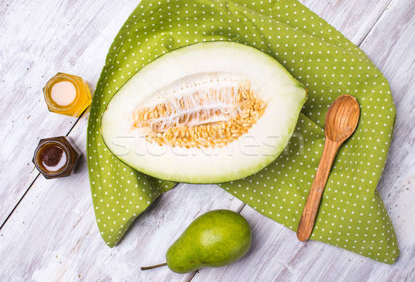 tasty melon with honey and pears on wood Stock photo © Arsgera