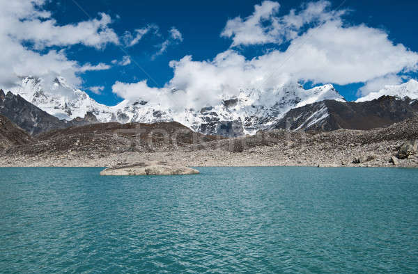 Clouds and Sacred Lake near Gokyo in Himalayas Stock photo © Arsgera