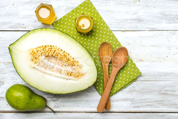 green pear Healthy melon and honey on rustic wood Stock photo © Arsgera