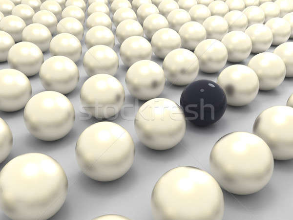 Black extraordinary pearl among white ones Stock photo © Arsgera