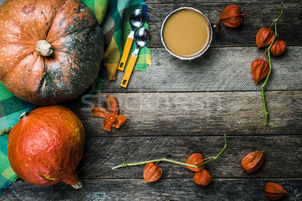 Rustic style pumpkins vegetable soup and ground cherry on wood Stock photo © Arsgera