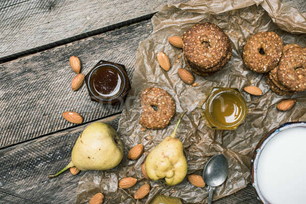 Pears nuts Cookies and milk on rustic wood Stock photo © Arsgera