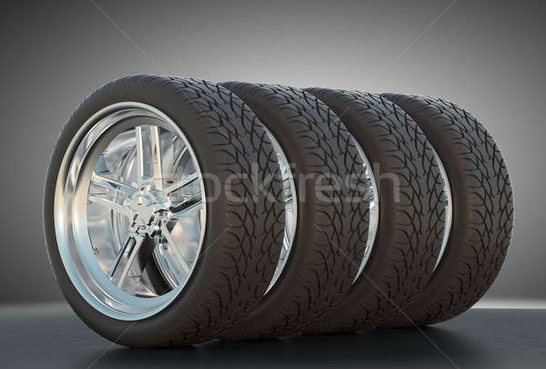 Group of four automotive wheels with studio light Stock photo © Arsgera