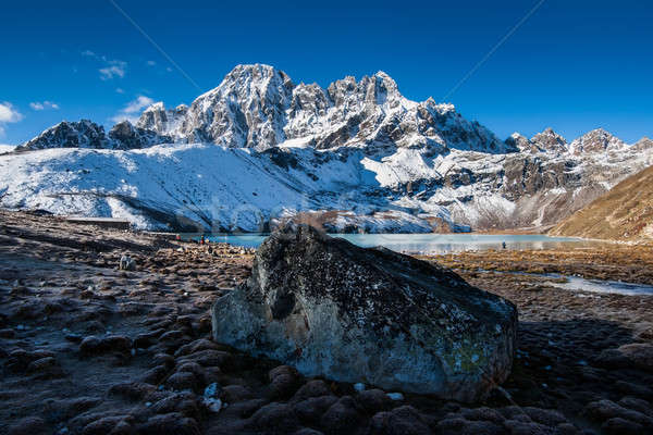 Sacred Gokyo Lake near village and mountain peaks in Himalayas Stock photo © Arsgera