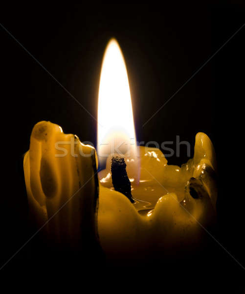 closeup of candle light in the darkness Stock photo © Arsgera