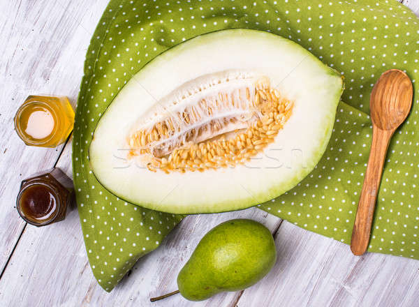 Tasty melon with honey and pears on napkin Stock photo © Arsgera