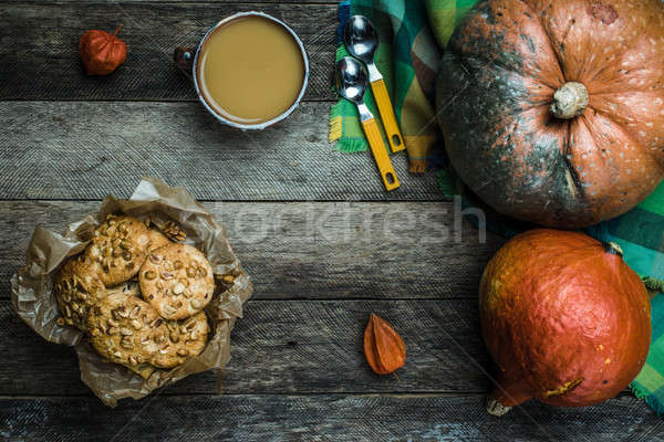 Rustic style pumpkins soup and cookies with seeds on wood Stock photo © Arsgera