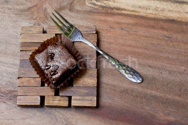 Pieces of chocolate brownie on a wooden with fork Stock photo © art9858