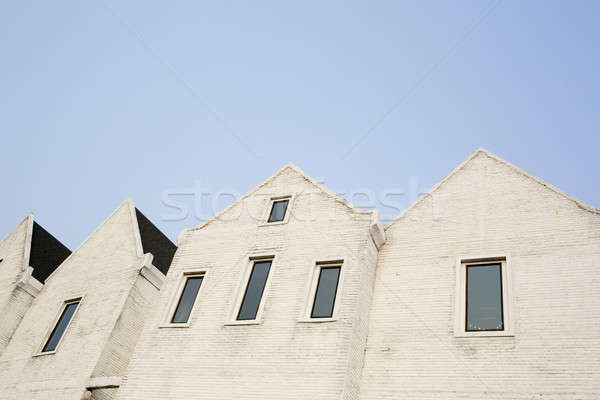 White cement brick block wall with a narrow window Stock photo © art9858