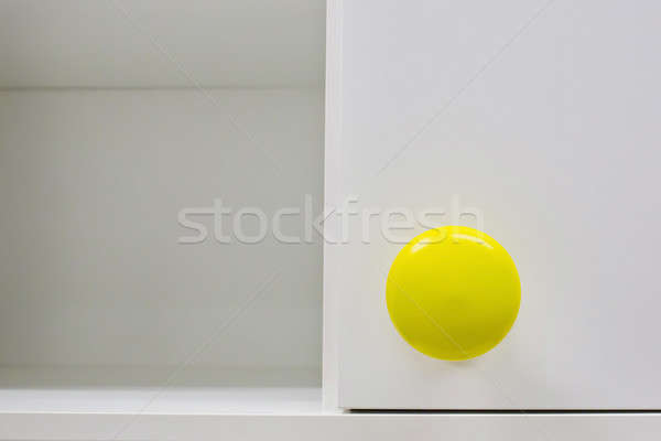 Cupboard handle with yellow color Stock photo © art9858
