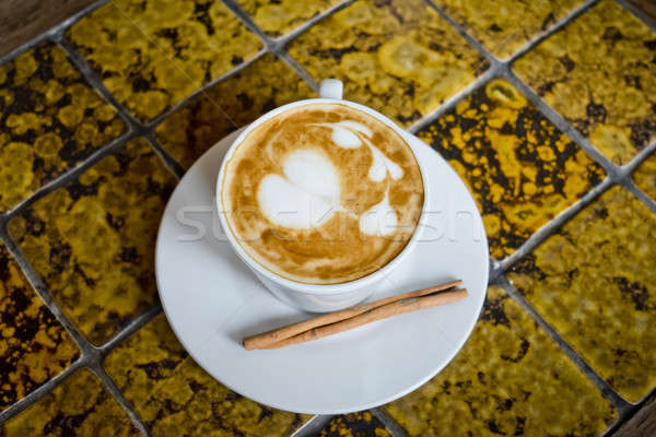 A cup of cafe latte and Cinnamon stick. Stock photo © art9858