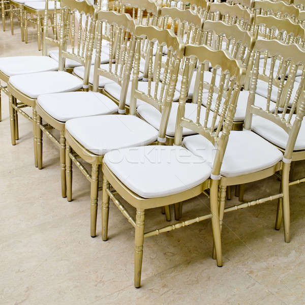 Rows of gold chairs - meeting background Stock photo © art9858