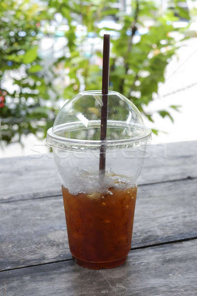 Delicious ice coffee americano with coffee glass lid and straws  Stock photo © art9858