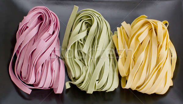 Bundles of dried ribbon color  pasta Stock photo © art9858