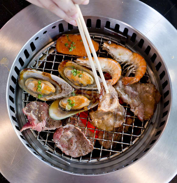 Mixed Roasted Meat and Seafood and Chopsticks on the BBQ Grill o Stock photo © art9858