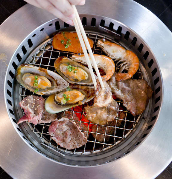 Stock photo: Mixed Roasted Meat and Seafood and Chopsticks on the BBQ Grill o