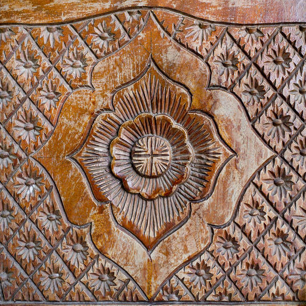 Pattern of flower carved on wood background Stock photo © art9858