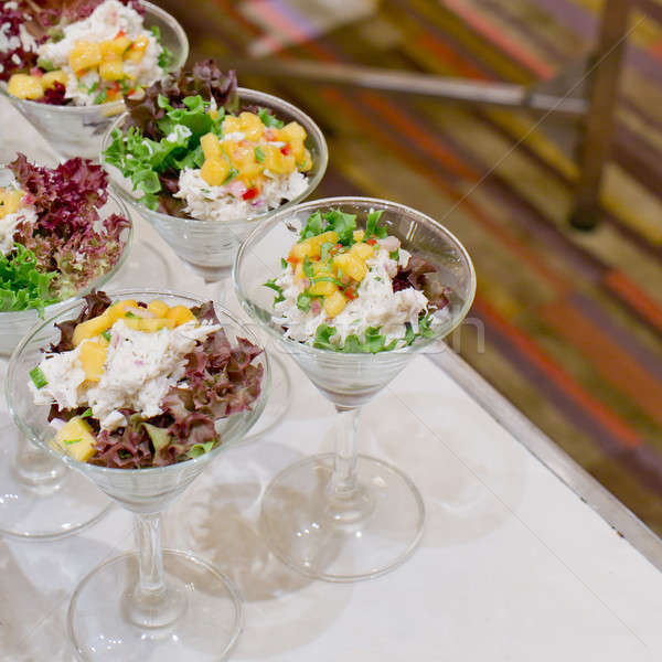 Appetizing salad in a transparent salad bowl, food closeup Stock photo © art9858