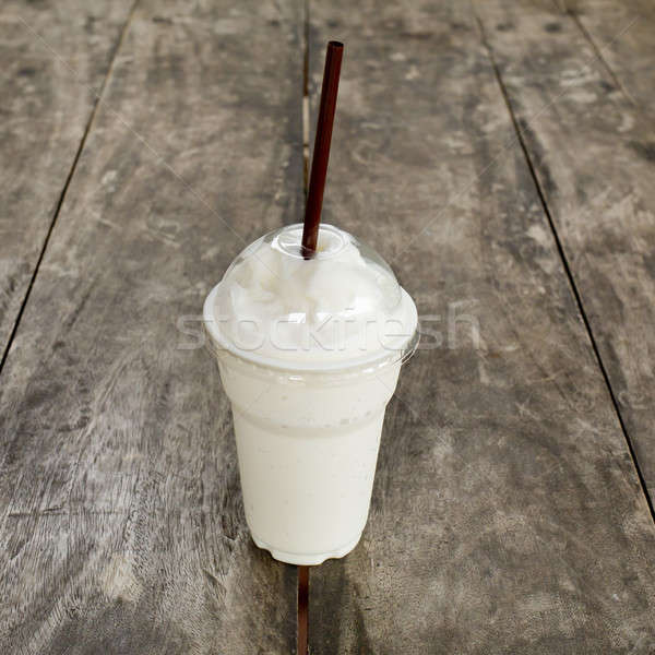 Fresh milk shake drink on wooden table. Stock photo © art9858