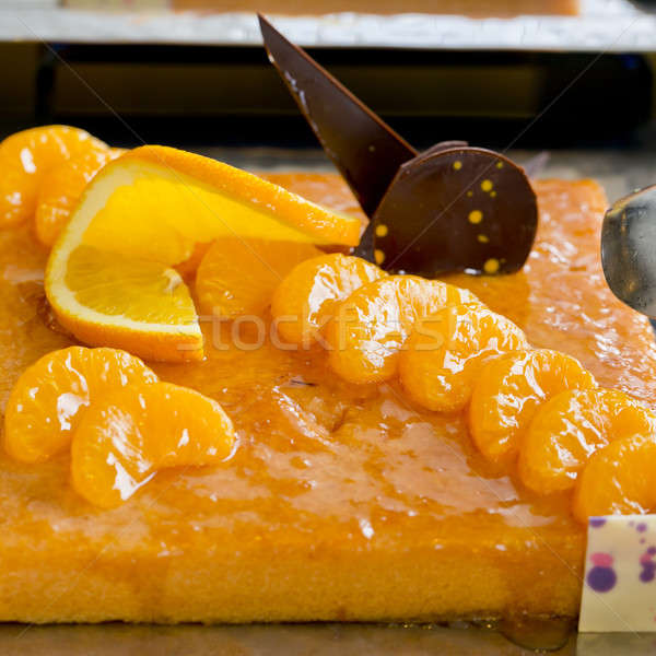 Orange and a piece of orange cake with chocolate topping - finge Stock photo © art9858
