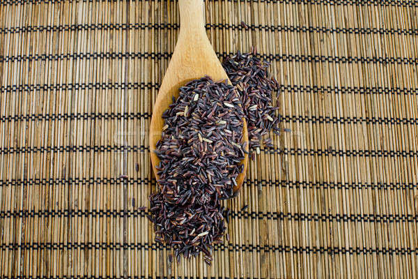 Thai black jasmine rice (Rice berry) in wooden spoon Stock photo © art9858