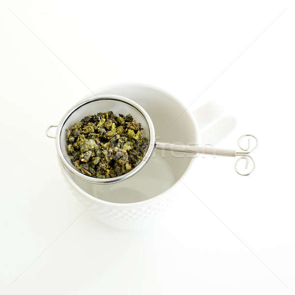 Herbal tea in a glass cup, metal sieve with dry herbal tea on a  Stock photo © art9858