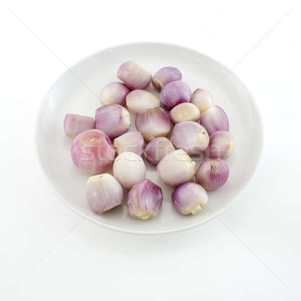 close up of a bowl of peeled shallots isolate white background Stock photo © art9858